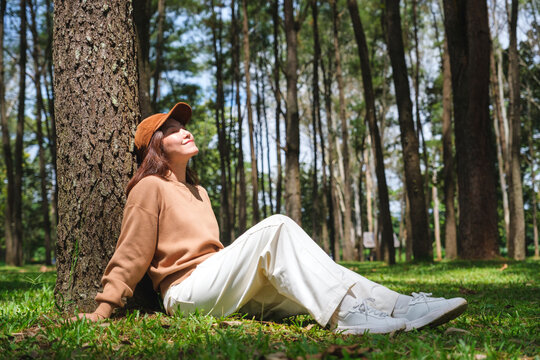 Portrait image of a woman sitting and relaxing in the park