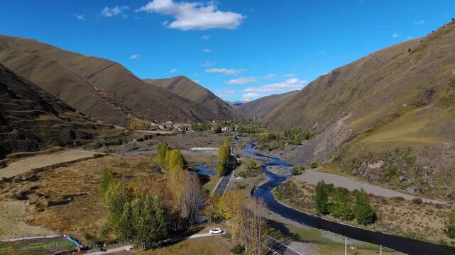 Aerial View of Mountain Valley River and Autumn Landscape in Tibet in Tibet, China