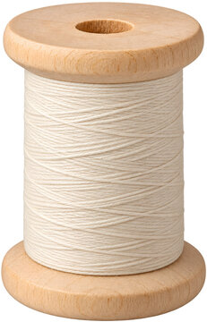 Wooden sewing spool with cream cotton thread isolated