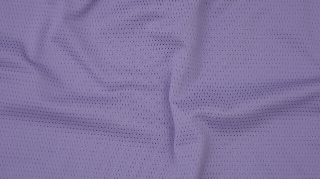 Texture of purple jersey clothing fabric. Flatlay style, close up, studio shot. Sport background. Fabric commonly used for sportswear as football, basketball, volleyball, hockey, rugby etc