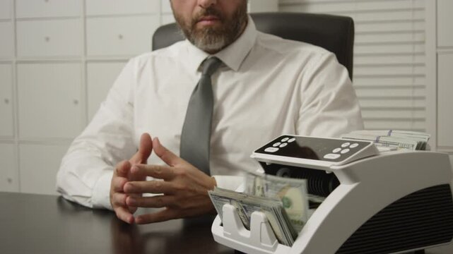 Finance concept with hand and money counter. Counting dollars. Business finance management in office. Bankers hands counting money in office. Finance office scene with hands and cash counter.