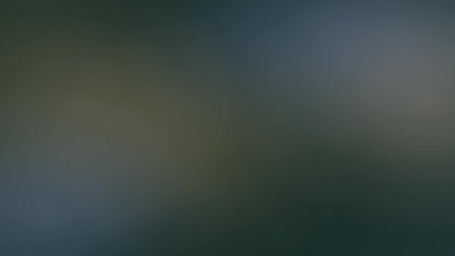 Dark green blue and gray blurred gradient background with diffused light areas, abstract moody atmospheric motion backdrop for video, presentation and digital content