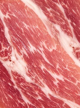 Close-up texture of raw marbled beef meat with fat veins