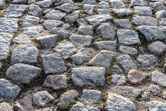 Cobblestone Road Surface With Rough Gray Stones, Natural Texture, Pavement And Background