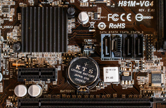 Detailed close-up of a brown printed circuit board featuring branded components, a CMOS battery, and the ASRock H81M-VG4 model marking. 