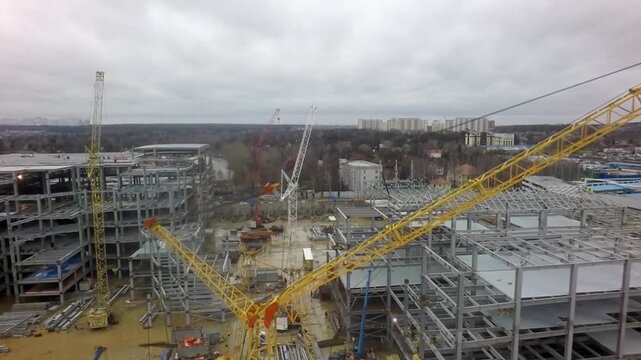 Aerial View of Huge Construction Site With Cranes and Building Frames