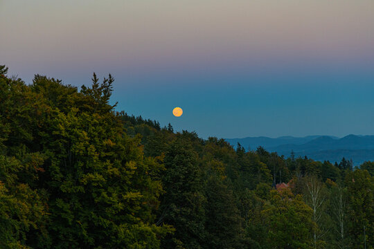 Full moon rising over the Karkonosze, Giant Mountains, a mountain landscape. Poland.