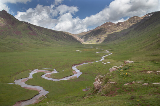 Aguas tuertas valley river meandering through pyrenees landscape