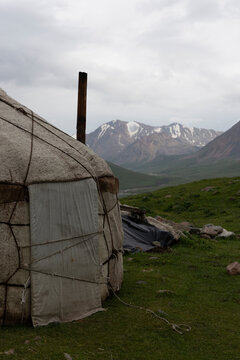 Traditional yurt dwelling in a remote mountain landscape