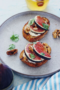 Fresh fig and walnut toast with cream cheese appetizer