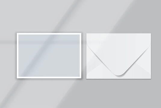 Blank postcard and envelope mockup on a soft background, featuring a minimal layout with realistic shadows for stationery branding, invitation design, wedding cards, gift card and print presentation