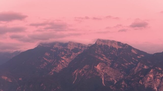 Mount Ortigara mountain massif glowing beneath pink twilight