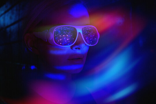 Woman in virtual reality headset explores neon cyberspace