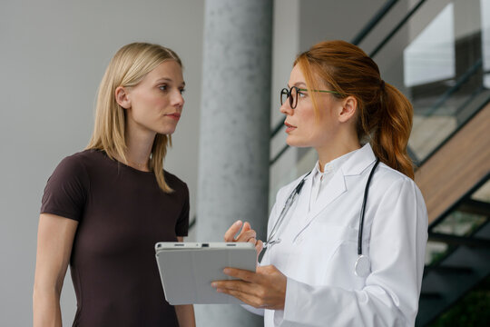 Doctor explaining diagnosis to patient during consultation indoors