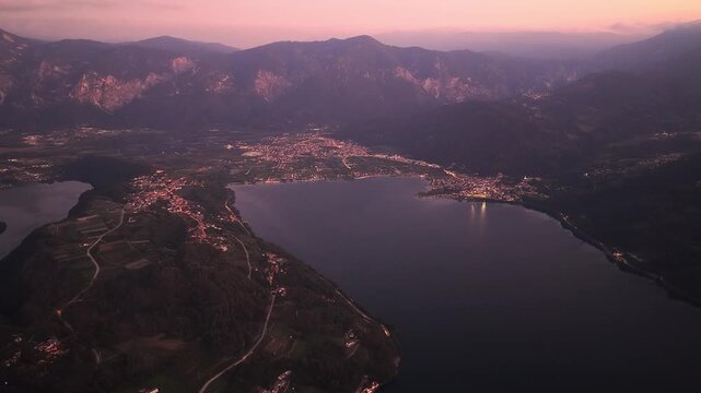 Twilight aerial panorama of Lake Caldonazzo surrounded