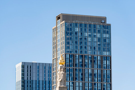 Modern skyscraper and monument at Princes Dock in Liverpool
