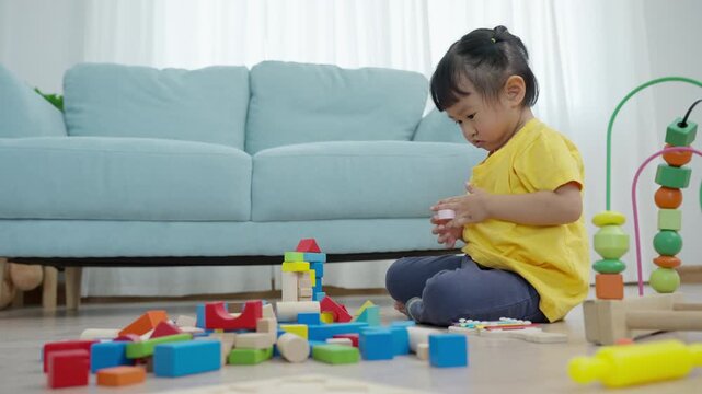 Happy Asia children play and learn toy blocks.family is happy and excited in the house. daughter having fun spending time, Activity, development, IQ, EQ, meditation, brain, muscles, essential skills.