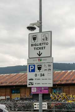 26 July 2026, Toblach, Italy. Parking ticket and payment information at a public parking area near the railway station