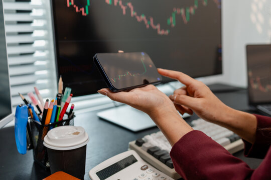 Professional investor monitoring financial markets and analyzing investment opportunities in a modern office, representing stock trading, market research, portfolio management.