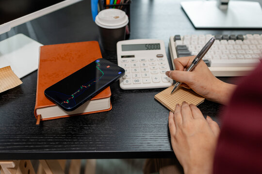 Professional investor monitoring financial markets and analyzing investment opportunities in a modern office, representing stock trading, market research, portfolio management.