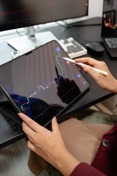 Professional trader monitoring financial markets and analyzing investment opportunities across multiple trading platforms, representing stock analysis, market research.