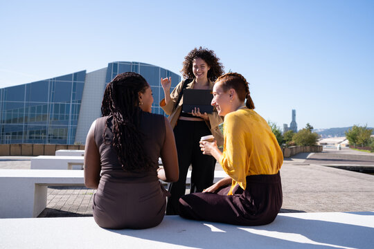 African American and white women conversing outdoors