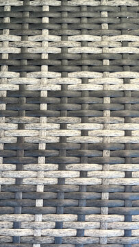 Textura de rat&aacute;n sint&eacute;tico trenzado en tonos grises y beige con patr&oacute;n geom&eacute;trico repetitivo para fondo de dise&ntilde;o