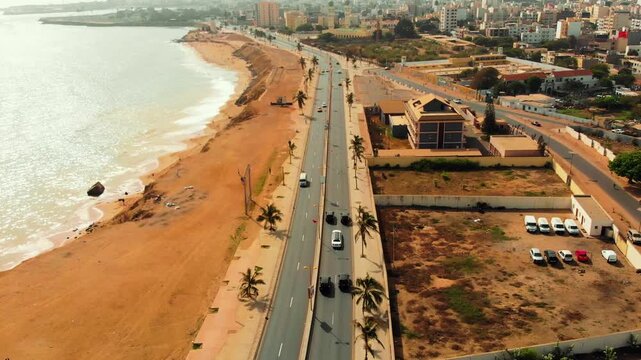 Drone tracks a security motorcade along a scenic coastal road in Morocco