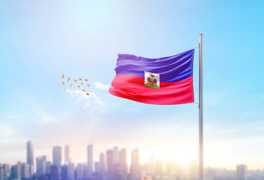 Haiti national flag waving with skyline and buildings. Haitinational flag for independence day.