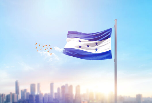 Honduras national flag waving with skyline and buildings. Honduras national flag for independence day.