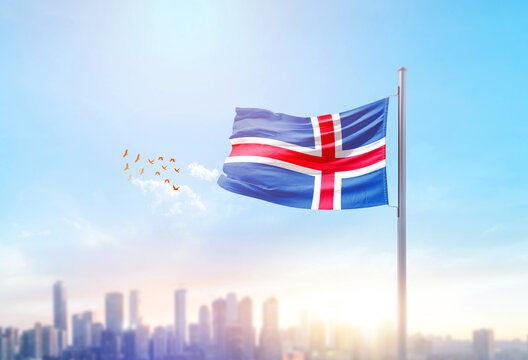 Iceland national flag waving with skyline and buildings. Iceland national flag for independence day.