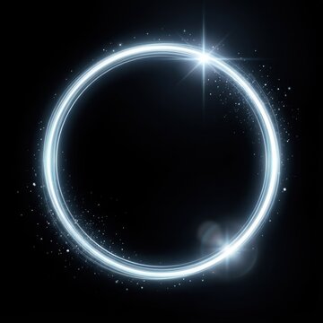 Bright glowing light ring with starburst on black background during night