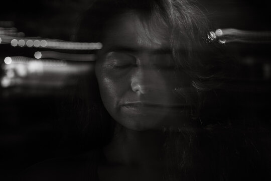 Headache, Portrait Of Stressed Woman, mental health, Motion Blur black and white shot with closed eyes