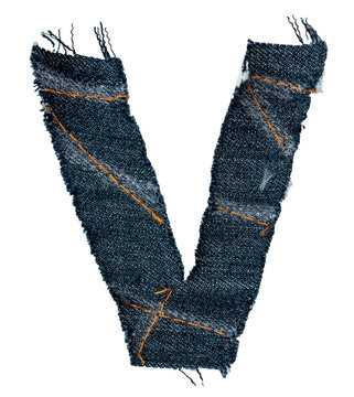 A letter of the alphabet cut out of a piece of denim fabric on a white background. Letters isolated