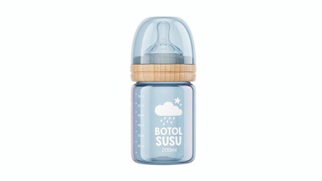 Baby milk bottle made of blue tinted glass with a wooden ring and silicone nipple on a plain white background, for infant feeding