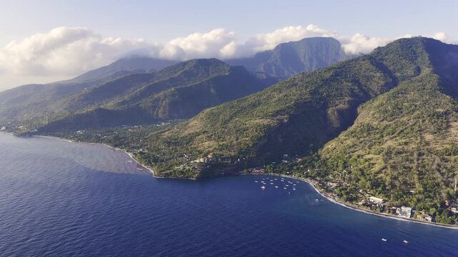 Aerial drone flying over amed beach coastline in bali