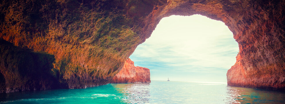 Coastal rocky seascape. Entrance in Benagil cave in Algarve region. Atlantic Ocean, Portugal, Europe