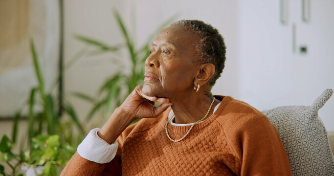 Senior, woman and relax in home with thinking, quiet introspection or peaceful solitude on sofa. Elderly, black person and serious in house for retirement reflection, nostalgic memory or calm morning