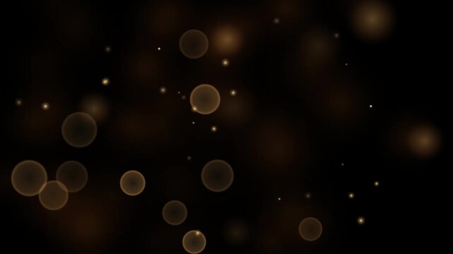Golden glowing bokeh circles float against a dark, mysterious background, creating a magical and ethereal atmosphere perfect for festive or abstract designs.