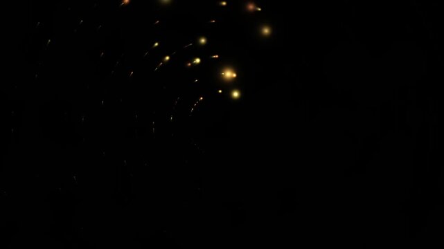 A dark sky illuminated by the dazzling display of distant fireworks, painting streaks of golden light against the deep blackness.