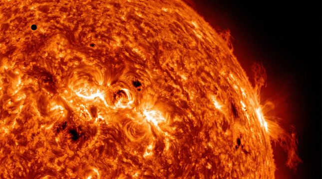 Small dark planet transiting the active surface of the sun