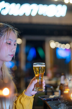food and drink male friends are happy drinking beer and clinking glasses at a bar or pub.
