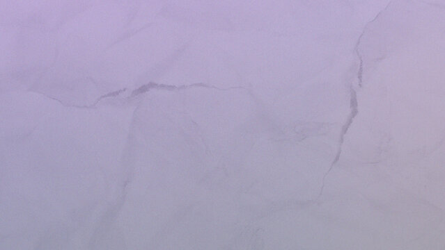 Abstract texture of lavender purple crumpled paper surface with a close up view of a light purple paper with a delicate