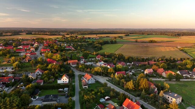 Suburban houses and autumn fields at sunset near Wrocław, Poland