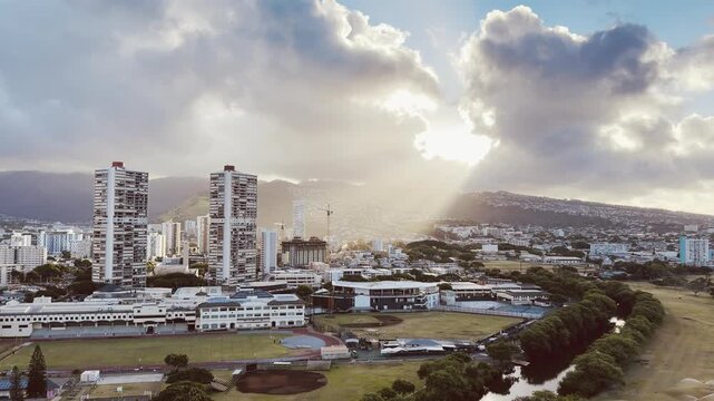 Cumulus congestus or towering cumulus clouds. City of Honolulu, Oahu, Hawaii. Trade Wind, Koʻolau Range. Crepuscular rays, god rays, twilight rays, or Jacob's ladder