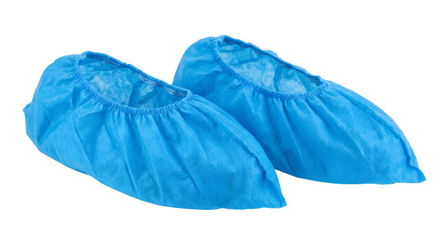 Pair of blue disposable surgical shoe covers for medical hygiene protection, non woven protective boot booties for hospital cleanroom safety, isolated transparent background cutout PNG