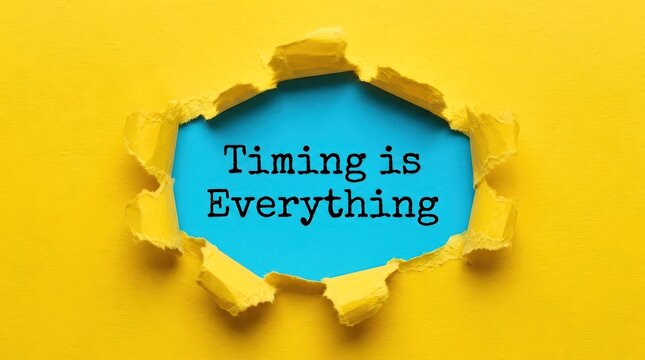 Timing is everything motivational message revealed through ripped bright yellow paper exposing blue background