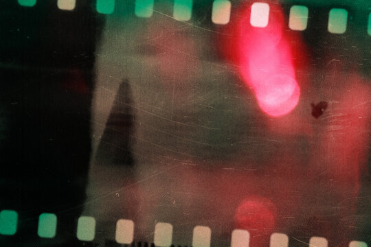 Filmstrip Sprocket Overlay with Red Orange Rainbow Light Leak Glow, Vintage Film Texture Background