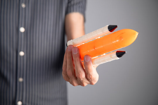 Man holding toy rocket. Startup. Business