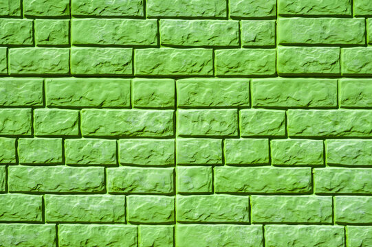 green brick wall background close-up